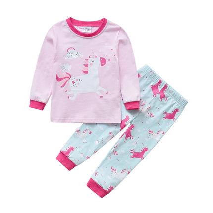 Mädchen in einem langärmeligen Einhorn Pyjama Set mit Cartoon-Einhorn-Print und passender Hose