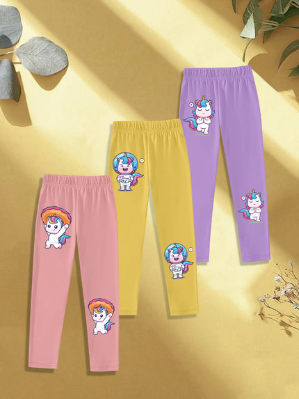 Drei Einhorn Leggings im Set mit Cartoon-Einhörnern, die Donuts essen, auf hellem Hintergrund