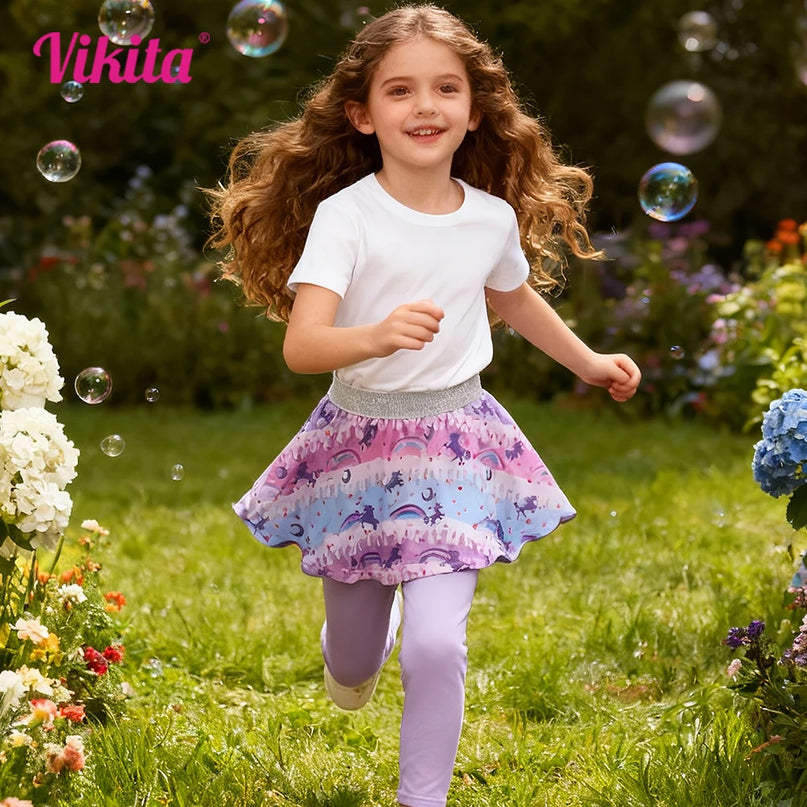Mädchen in lila Einhorn Leggings mit angenähtem Regenbogen-Einhorn-Rock aus weicher Baumwolle
