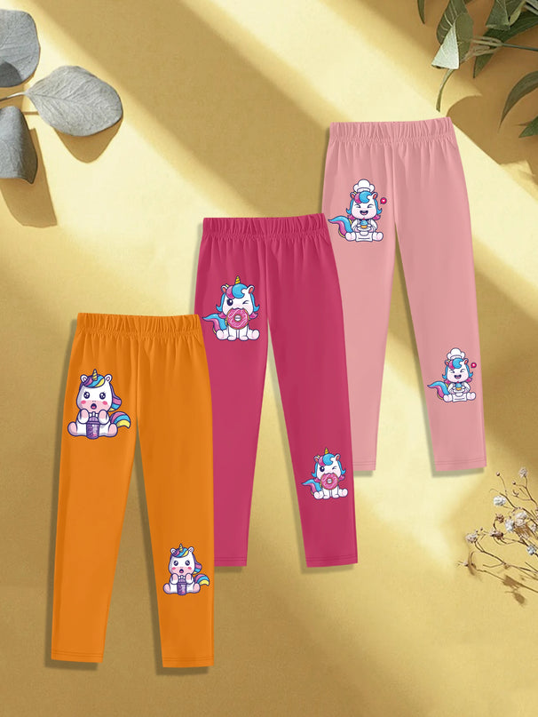 Drei Mädchen Einhorn Leggings mit Einhörnern, die Boba trinken, Donuts essen und Kuchen backen