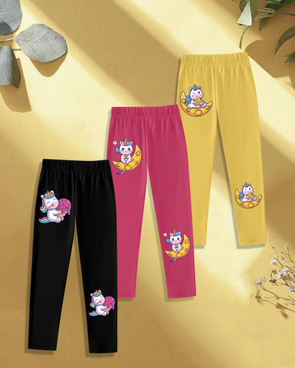 Drei Einhorn Leggings im Set mit Einhörnern, die Eiskrem auf dem Mond halten, auf hellem Hintergrund