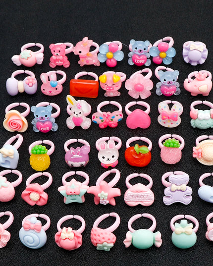 Set aus 10 oder 20 bunten Einhorn Ringen mit verspielten Blumen- und Tiermotiven für Kinder