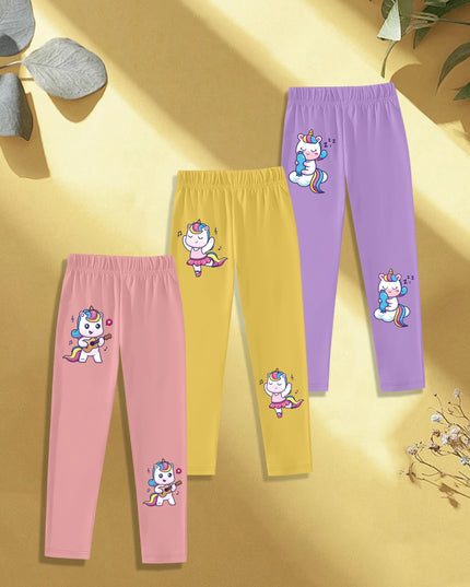 Drei Einhorn Leggings im Set mit tanzenden Cartoon-Einhörnern auf hellem Hintergrund für Mädchen