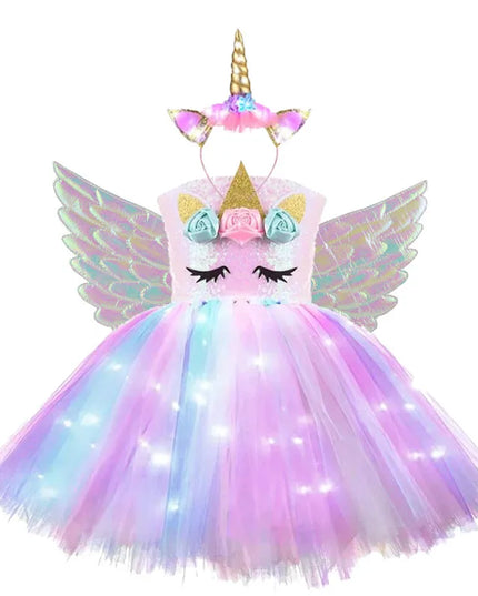Mädchen in einem leuchtenden Einhorn Nachtlicht Regenbogen Tutu Kleid mit Pailletten für eine Party