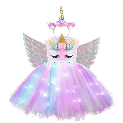 Mädchen in einem leuchtenden Einhorn Nachtlicht Regenbogen Tutu Kleid mit Pailletten für eine Party